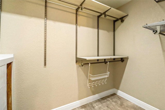 spacious closet with light wood finished floors