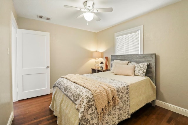 bedroom with visible vents, ceiling fan, baseboards, and wood finished floors