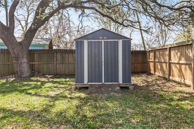 view of shed with a fenced backyard