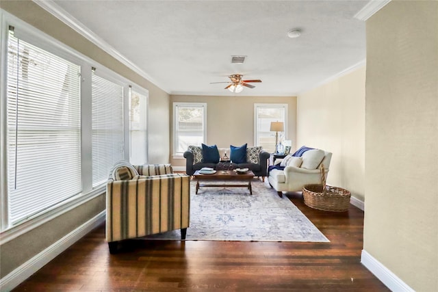 living room with ceiling fan, visible vents, wood finished floors, and crown molding