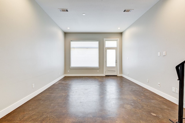 unfurnished room featuring recessed lighting, baseboards, visible vents, and concrete floors