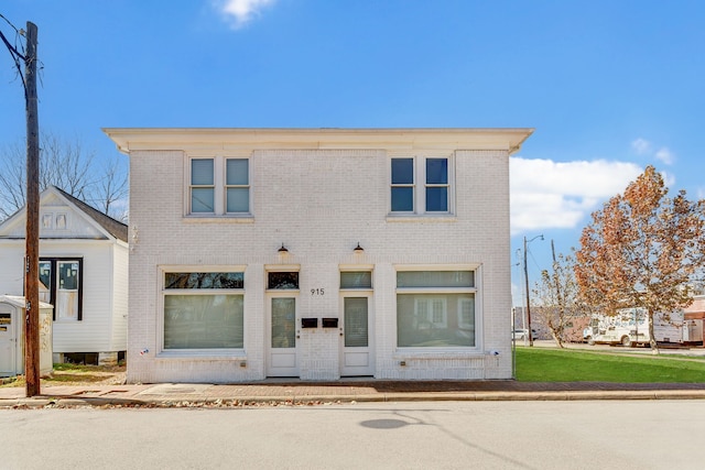 view of front of property featuring brick siding