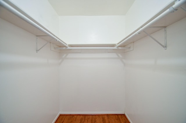 spacious closet with wood finished floors