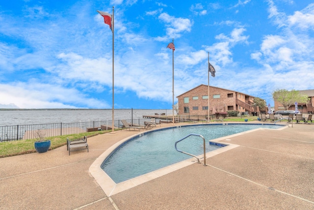 community pool featuring a patio area and fence