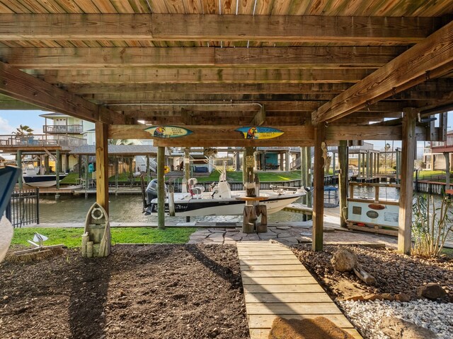 exterior space featuring a water view and boat lift