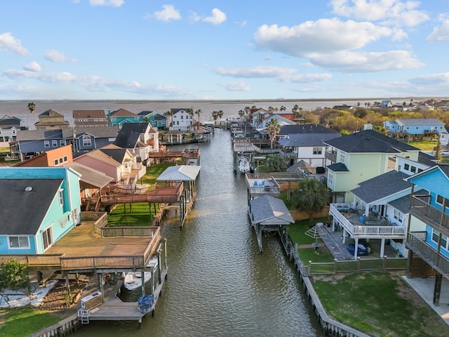 bird's eye view with a residential view and a water view