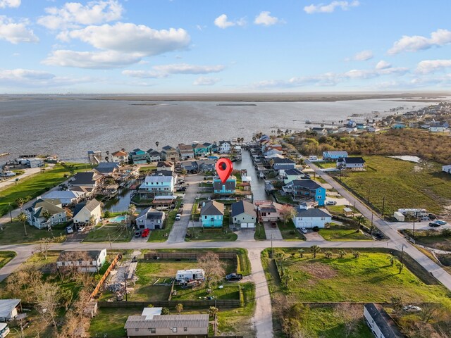 bird's eye view featuring a residential view and a water view