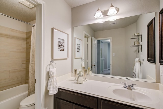 full bath featuring visible vents, shower / bath combo with shower curtain, toilet, and vanity