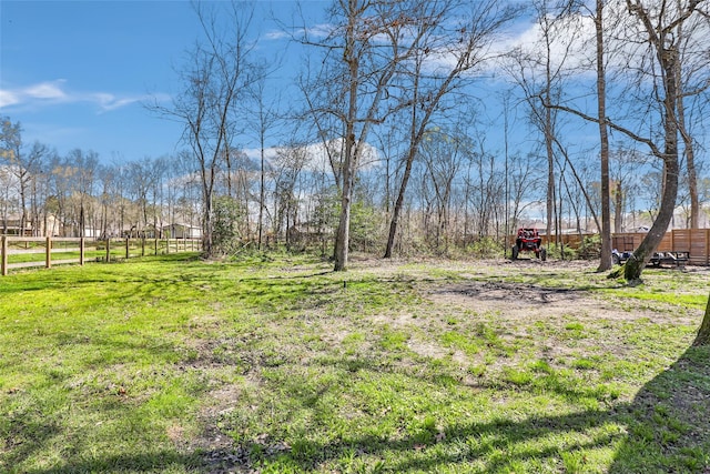 view of yard featuring fence