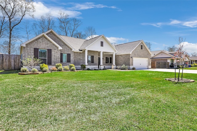 view of front of house with a front yard, fence, brick siding, and driveway