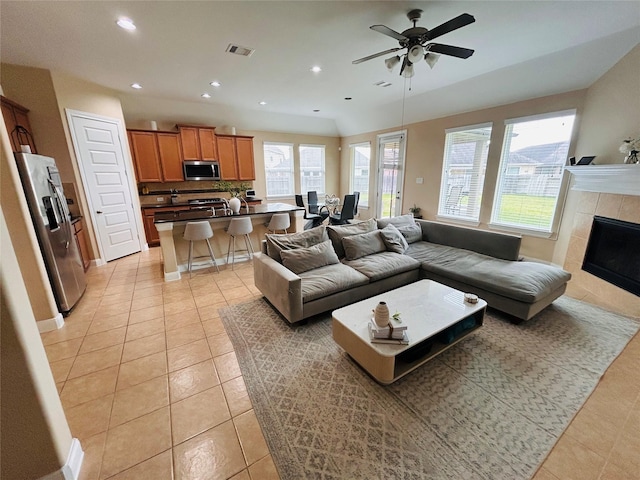 living room featuring visible vents, ceiling fan, recessed lighting, a fireplace, and light tile patterned flooring