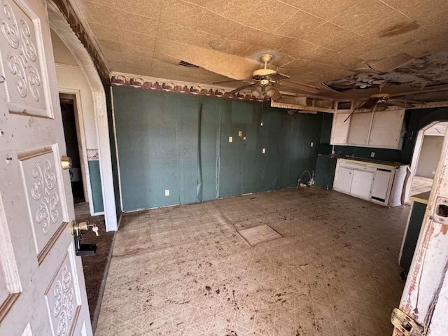 kitchen featuring tile patterned floors, white cabinets, and ceiling fan