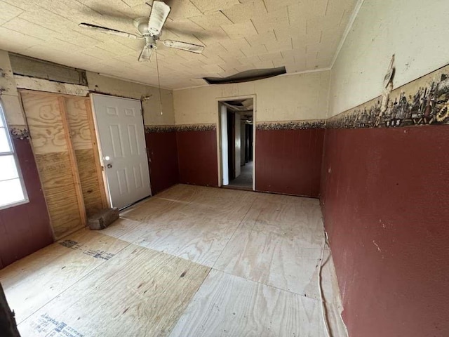 unfurnished room with a ceiling fan and light wood finished floors