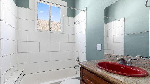 bathroom with vanity, toilet, and shower / bathtub combination