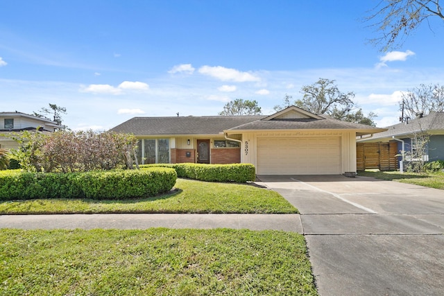 ranch-style home with a shingled roof, board and batten siding, concrete driveway, a front yard, and an attached garage