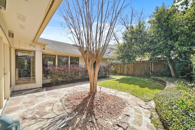 view of yard with a patio and fence