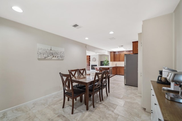 dining room featuring recessed lighting, visible vents, and baseboards