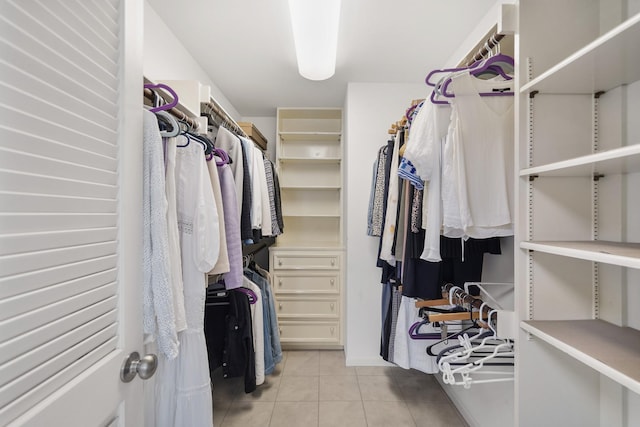 walk in closet featuring light tile patterned floors