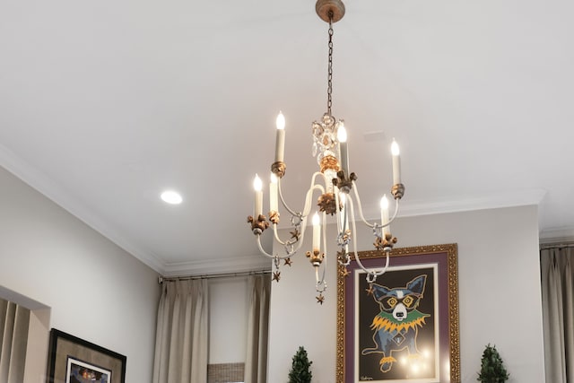 interior details with crown molding and a chandelier