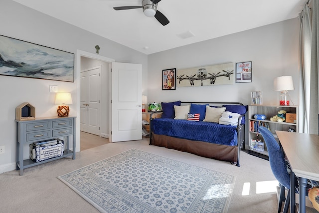 bedroom with light carpet and a ceiling fan