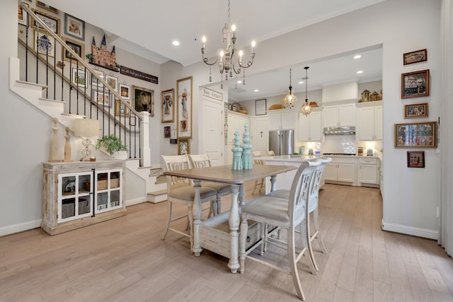 dining area featuring baseboards, a chandelier, stairway, light wood-style flooring, and recessed lighting