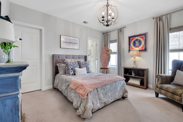 bedroom with light colored carpet, baseboards, a notable chandelier, and visible vents