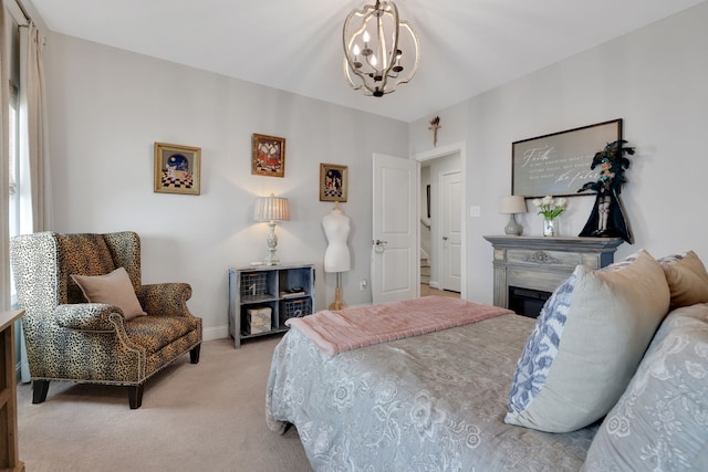 carpeted bedroom featuring an inviting chandelier, a fireplace, and baseboards