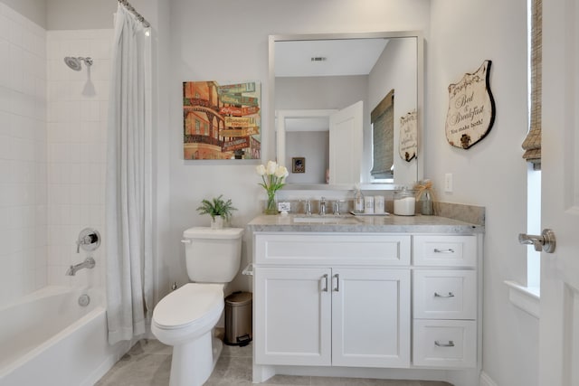 bathroom featuring tile patterned floors, visible vents, shower / bath combo with shower curtain, toilet, and vanity