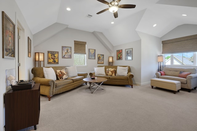 living room with vaulted ceiling, a ceiling fan, visible vents, and a wealth of natural light