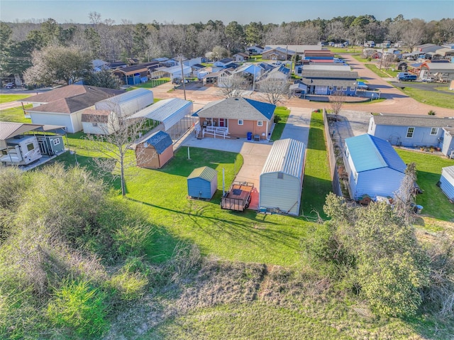 birds eye view of property with a residential view