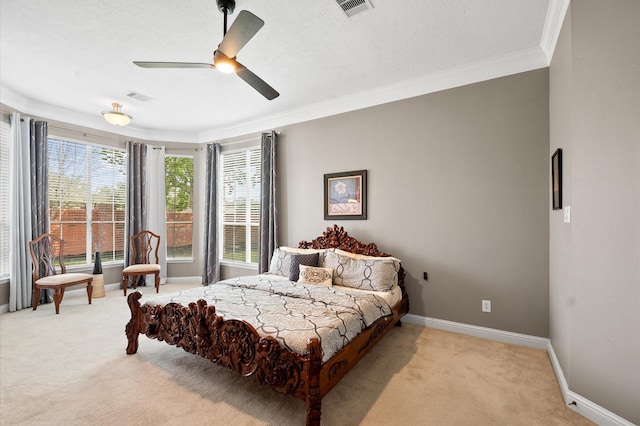 bedroom with multiple windows, light colored carpet, and crown molding