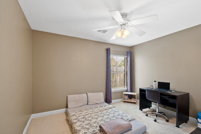 bedroom featuring light carpet and baseboards