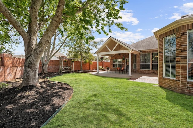 view of yard featuring a patio area and a fenced backyard