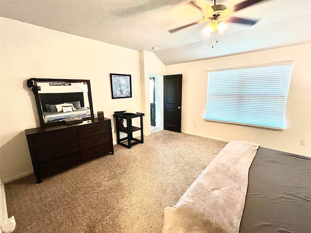 carpeted bedroom featuring ceiling fan, a textured ceiling, baseboards, and vaulted ceiling