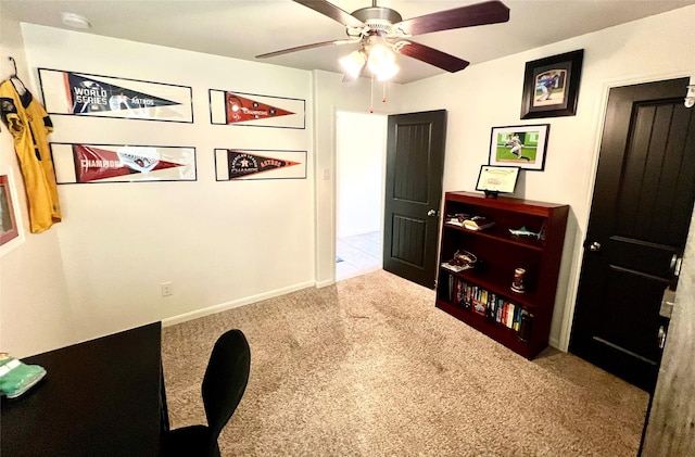 office space with a ceiling fan and carpet flooring