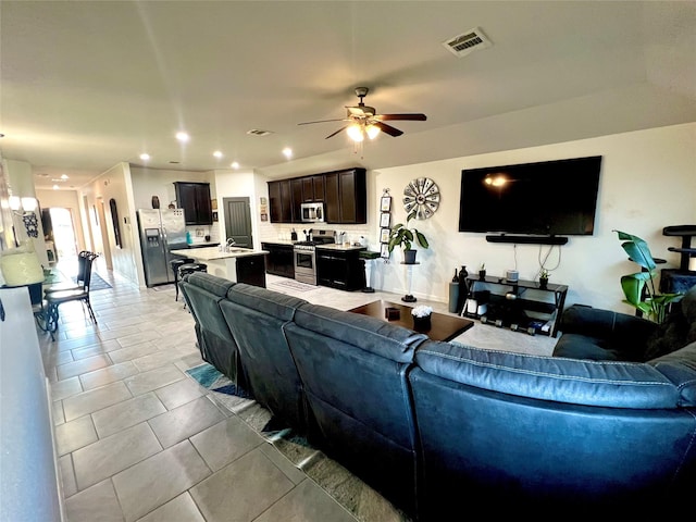 living area featuring recessed lighting, visible vents, a ceiling fan, and light tile patterned floors