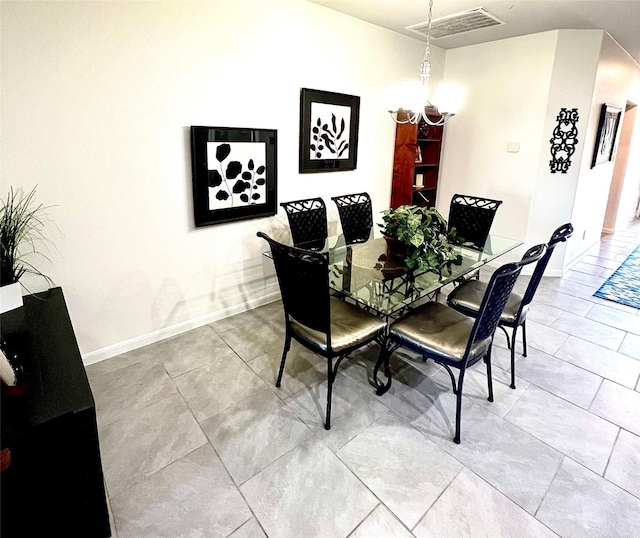 dining room featuring an inviting chandelier, baseboards, and visible vents