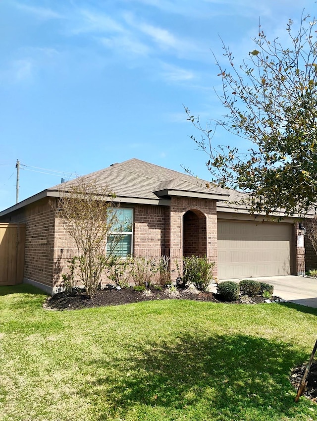 view of front of property featuring a garage, brick siding, concrete driveway, and a front lawn