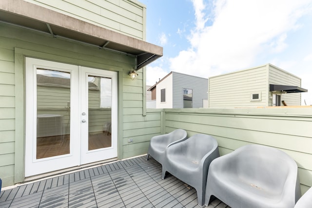 view of patio with french doors and central AC