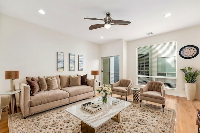 living room with recessed lighting, a ceiling fan, visible vents, and light wood finished floors