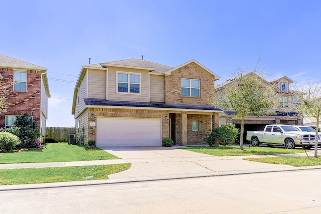 traditional-style home with a front lawn, fence, central air condition unit, concrete driveway, and a garage