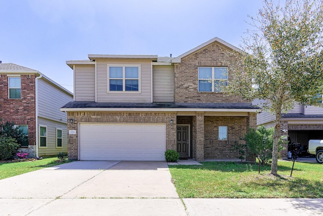 view of front of house with driveway, a front lawn, brick siding, and an attached garage