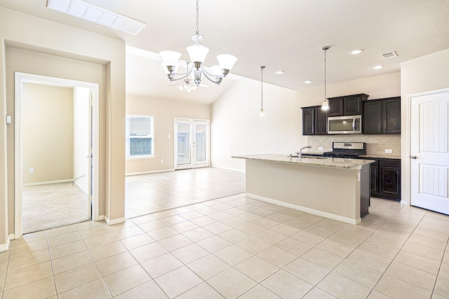 kitchen with light tile patterned floors, visible vents, appliances with stainless steel finishes, tasteful backsplash, and a chandelier