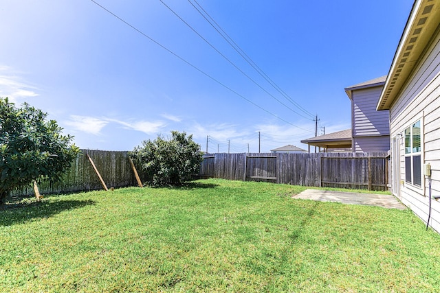 view of yard with a fenced backyard