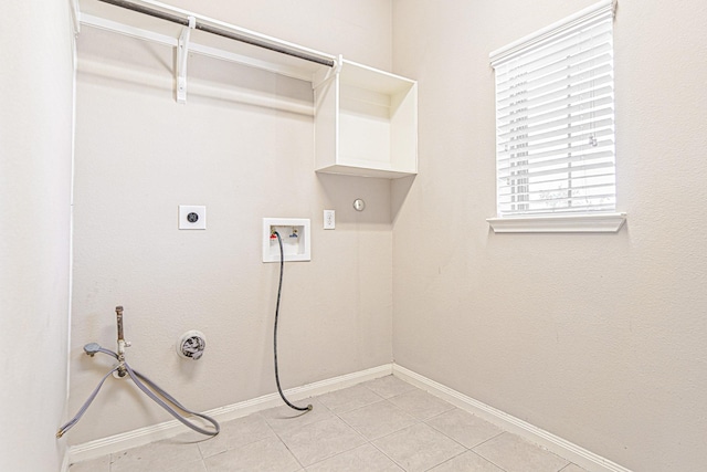 laundry room with electric dryer hookup, washer hookup, hookup for a gas dryer, baseboards, and laundry area