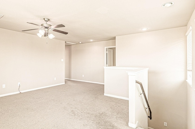 carpeted empty room featuring visible vents, recessed lighting, a ceiling fan, and baseboards