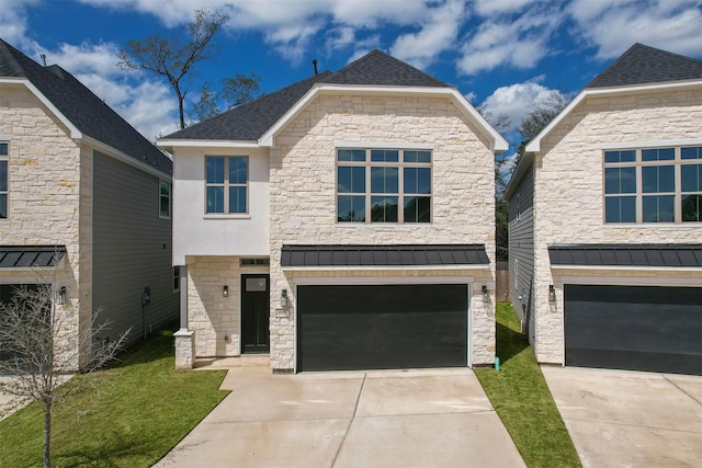 view of front facade featuring stone siding, driveway, a front yard, and a garage