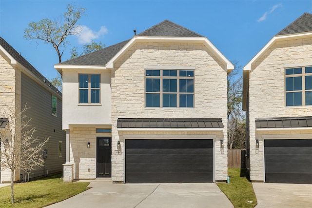 view of front of house with a standing seam roof, stone siding, metal roof, concrete driveway, and a garage