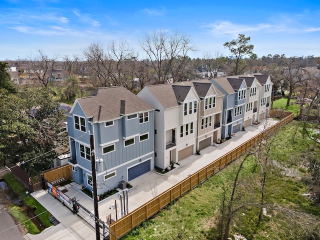 birds eye view of property with a residential view