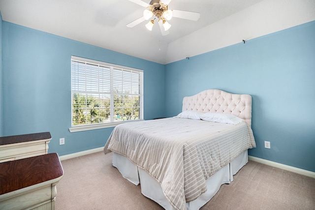 bedroom with ceiling fan, baseboards, carpet, and vaulted ceiling